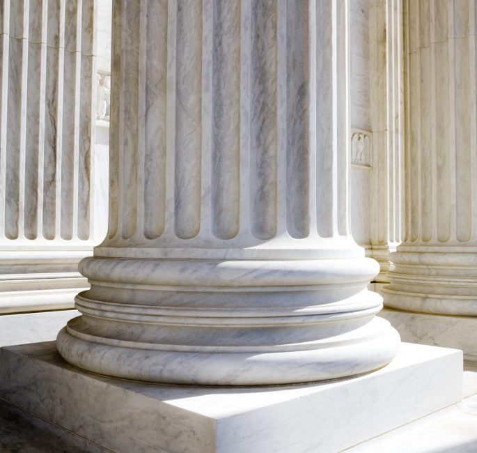 sun-shining-on-white-stone-pillars-outside-a-buil-2026-01-09-09-24-34-utc(1)