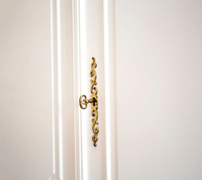 white-cupboard-doors-with-golden-key-in-keyhole-l-2026-01-11-09-09-08-utc(1)